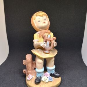Vintage Girl Figurine with Yellow Dress and Blue Socks